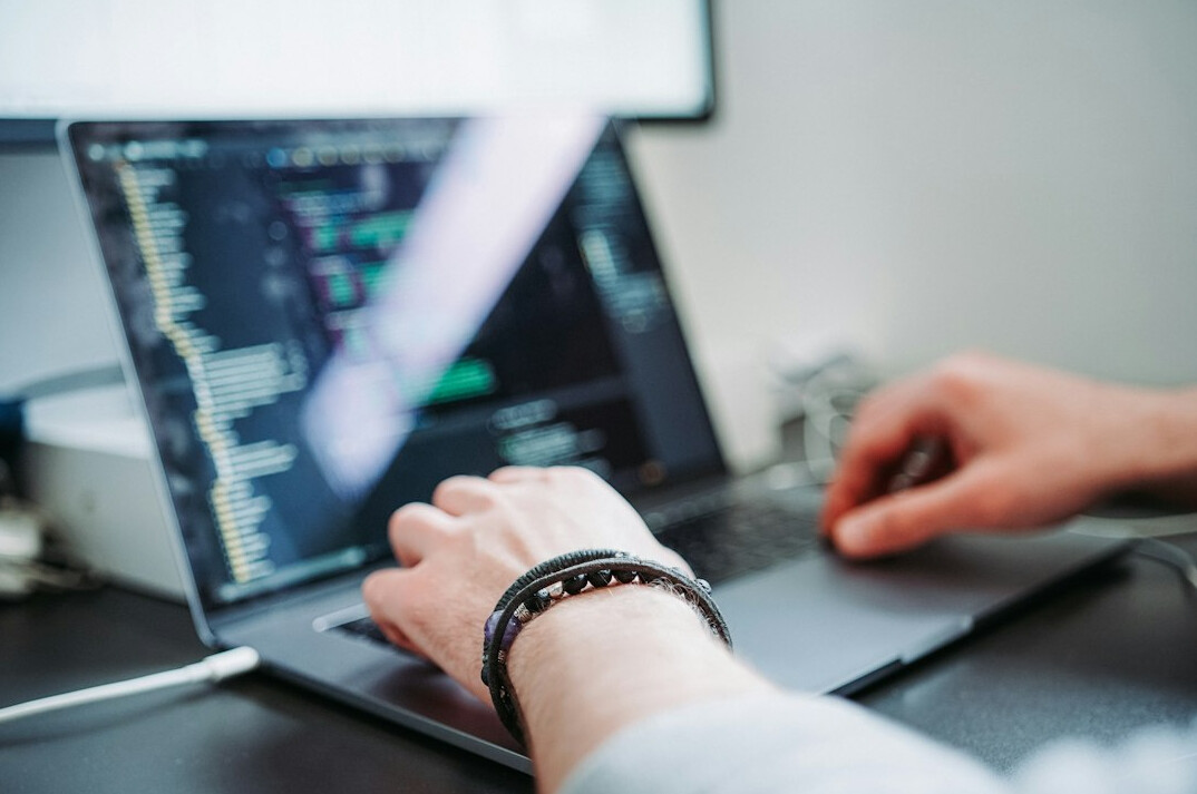 person learning coding on laptop