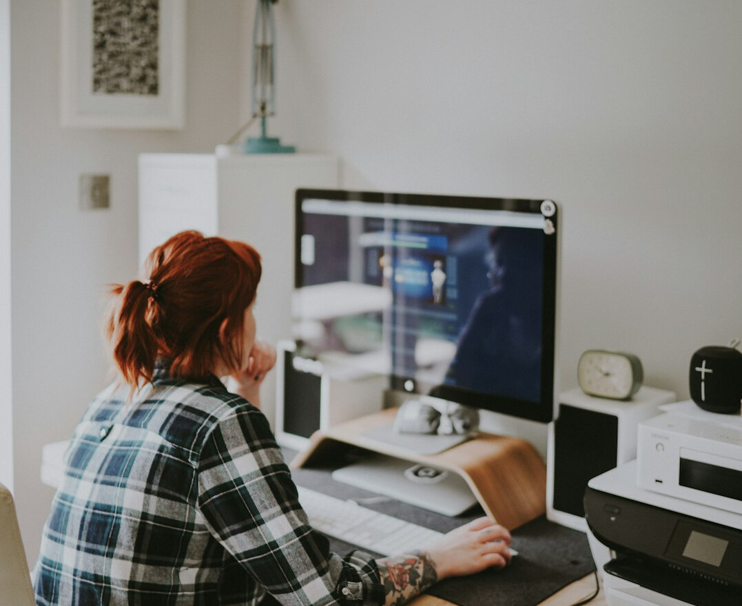 woman coding on computer